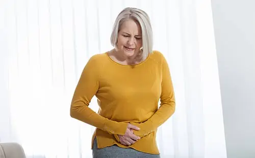 Woman with pain from bladder sling