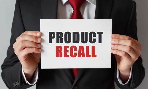 Lawyer holds product recall sign Exactech recall lawsuit concept